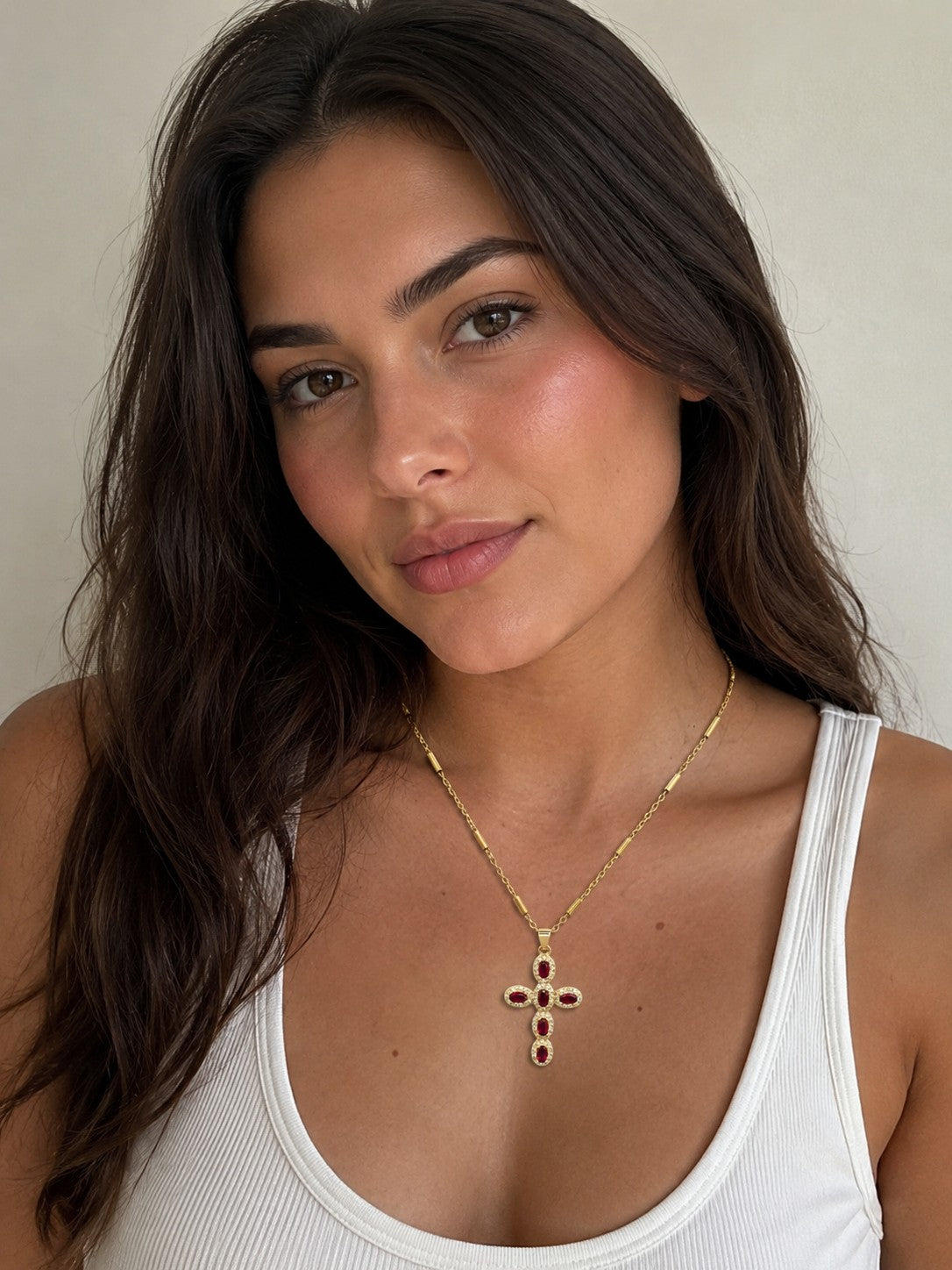 Close-up of the DUGO red Cross Pave Zirconia Necklace worn on the neck