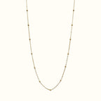 DUGO minimalist satellite bead necklace in 18K gold filled, featuring a dainty cable chain with evenly spaced beads.