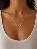 Woman wearing the DUGO silver Angel Wings Zirconia Necklace