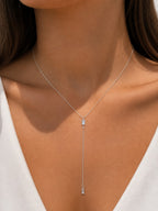 Woman wearing the DUGO silver Baguette Crystal Y Lariat Necklace