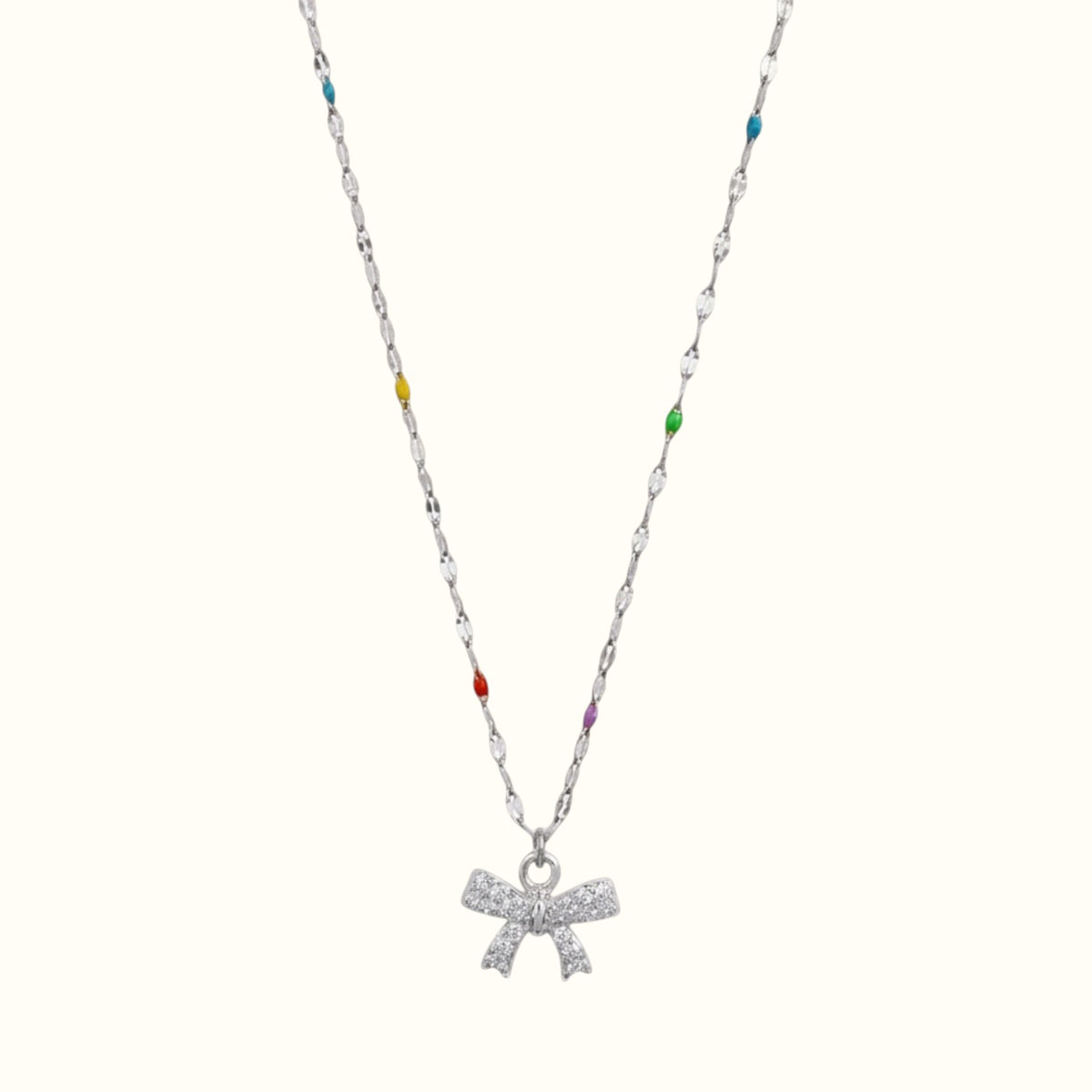 DUGO silver chain necklace featuring a mini bow pendant with sparkling zirconia stones and colorful enamel accents.