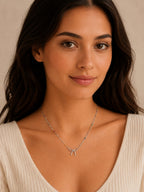 Close-up of the DUGO silver Colorful Enamel Bow Necklace worn on the neck