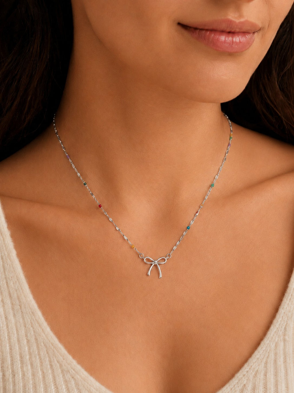 Woman wearing the DUGO silver Colorful Enamel Bow Necklace