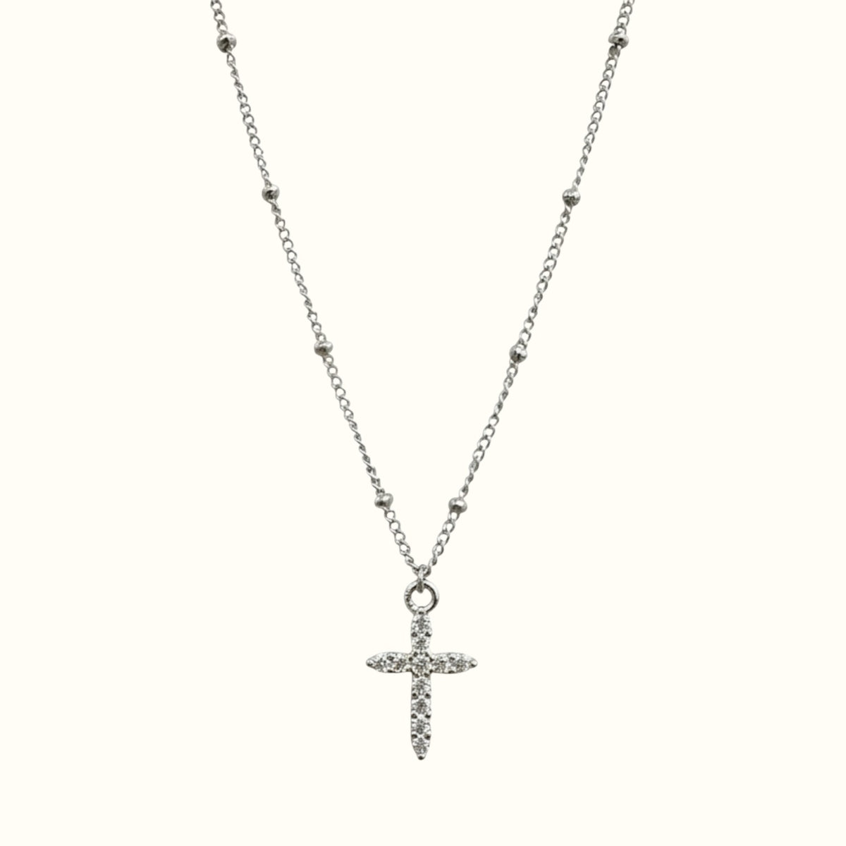 DUGO dainty silver-tone cross pendant necklace on a delicate ball chain, waterproof and tarnish-resistant design.