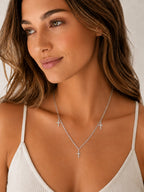 Close-up of the DUGO silver Cross Trio Necklace worn on the neck