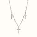 DUGO Cross Trio necklace featuring three silver-toned cross pendants on a delicate figaro chain