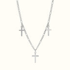 DUGO Cross Trio necklace featuring three silver-toned cross pendants on a delicate figaro chain