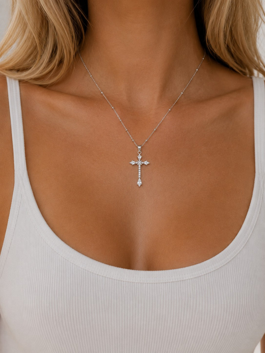 Woman wearing the DUGO silver Cross Zirconia Ball Chain Necklace
