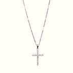 DUGO silver-tone cross pendant necklace featuring sparkling cubic zirconia stones on a delicate chain