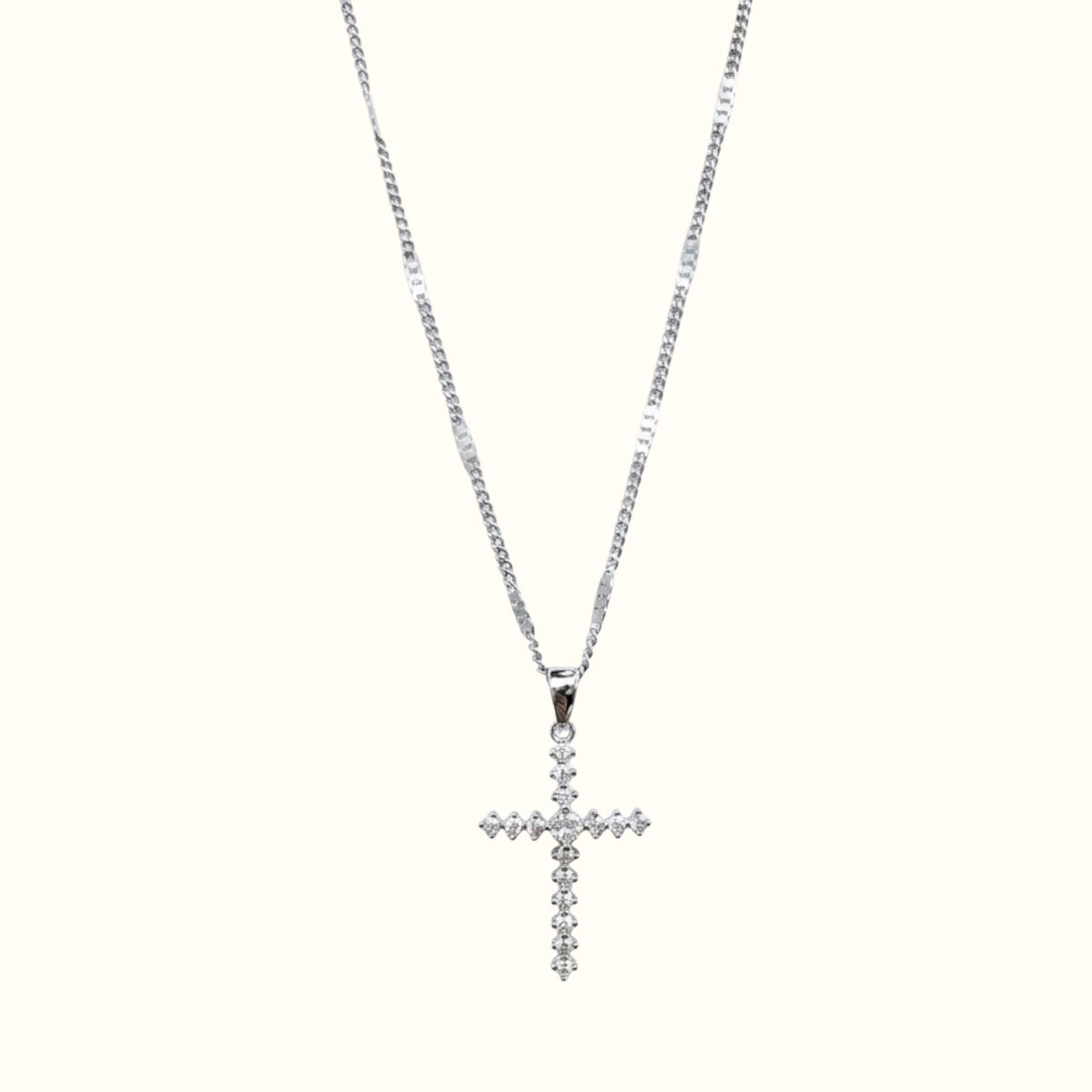 DUGO silver-tone cross pendant necklace featuring sparkling cubic zirconia stones on a delicate chain