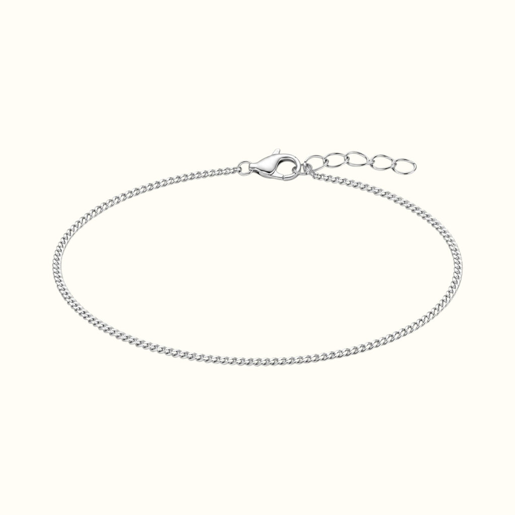 DUGO dainty silver curb chain bracelet made of polished stainless steel with a lobster clasp and extender chain.