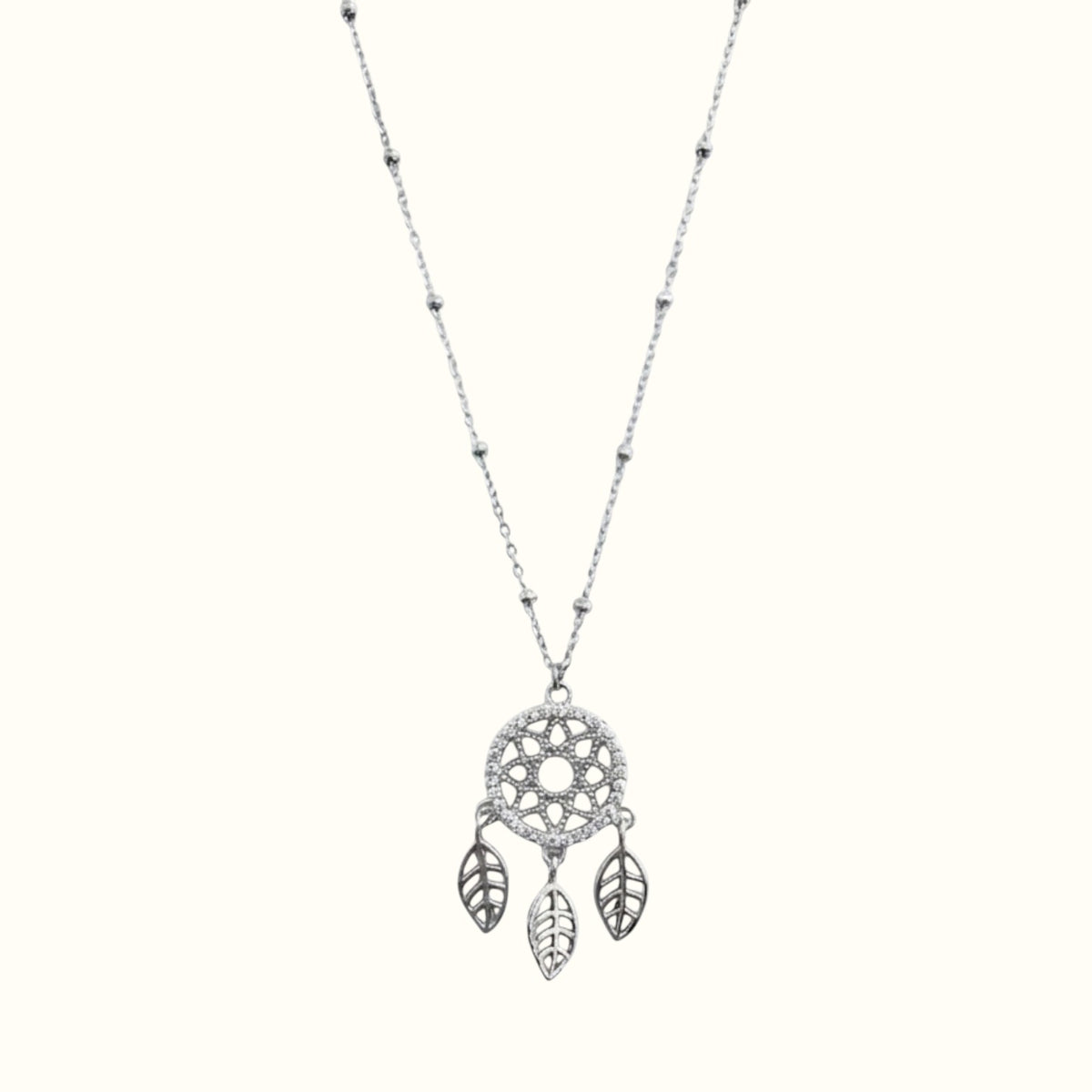DUGO silver-tone dreamcatcher necklace with cubic zirconia accents and delicate leaf charms on a beaded chain.