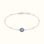 DUGO silver-tone stainless steel bracelet featuring a blue and white evil eye charm with delicate bead accents.