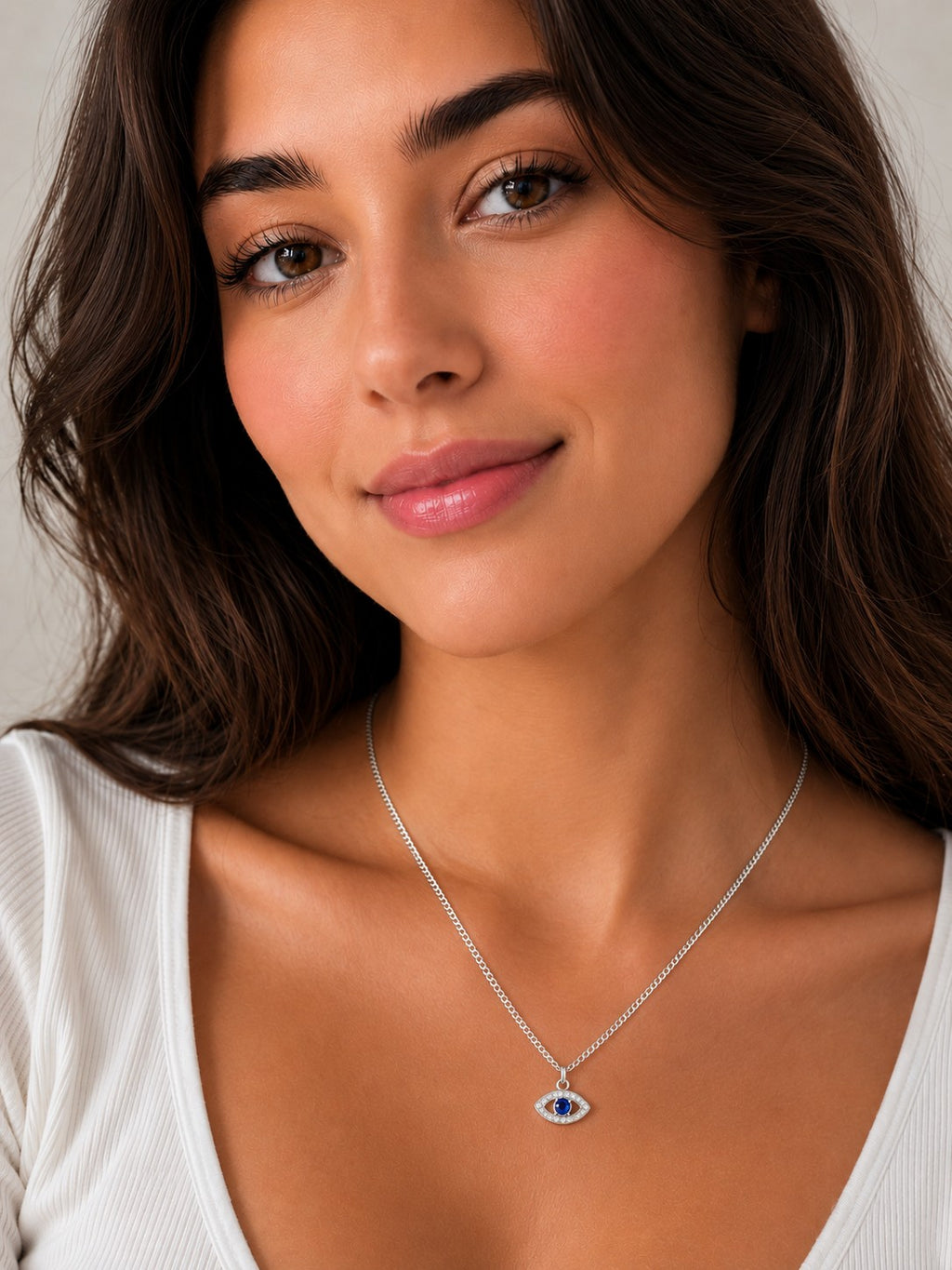 Close-up of the DUGO silver Evil Eye Zircon Necklace worn on the neck