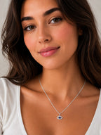 Close-up of the DUGO silver Evil Eye Zircon Necklace worn on the neck