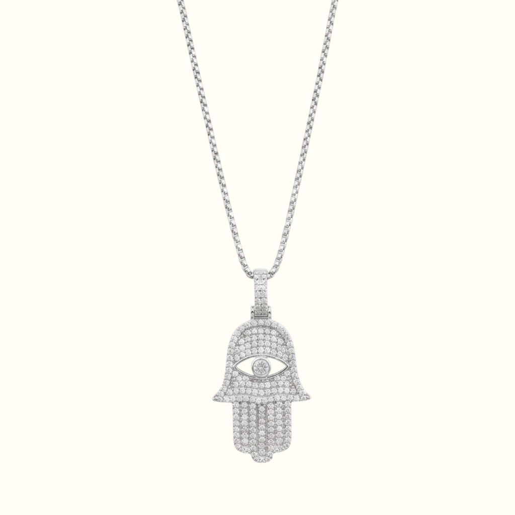DUGO silver Hamsa Hand evil eye pendant necklace featuring sparkling cubic zirconia stones on a delicate chain.