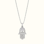 DUGO silver Hamsa Hand evil eye pendant necklace featuring sparkling cubic zirconia stones on a delicate chain.