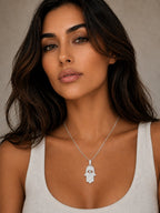Close-up of the DUGO silver Hamsa Large Necklace worn on the neck