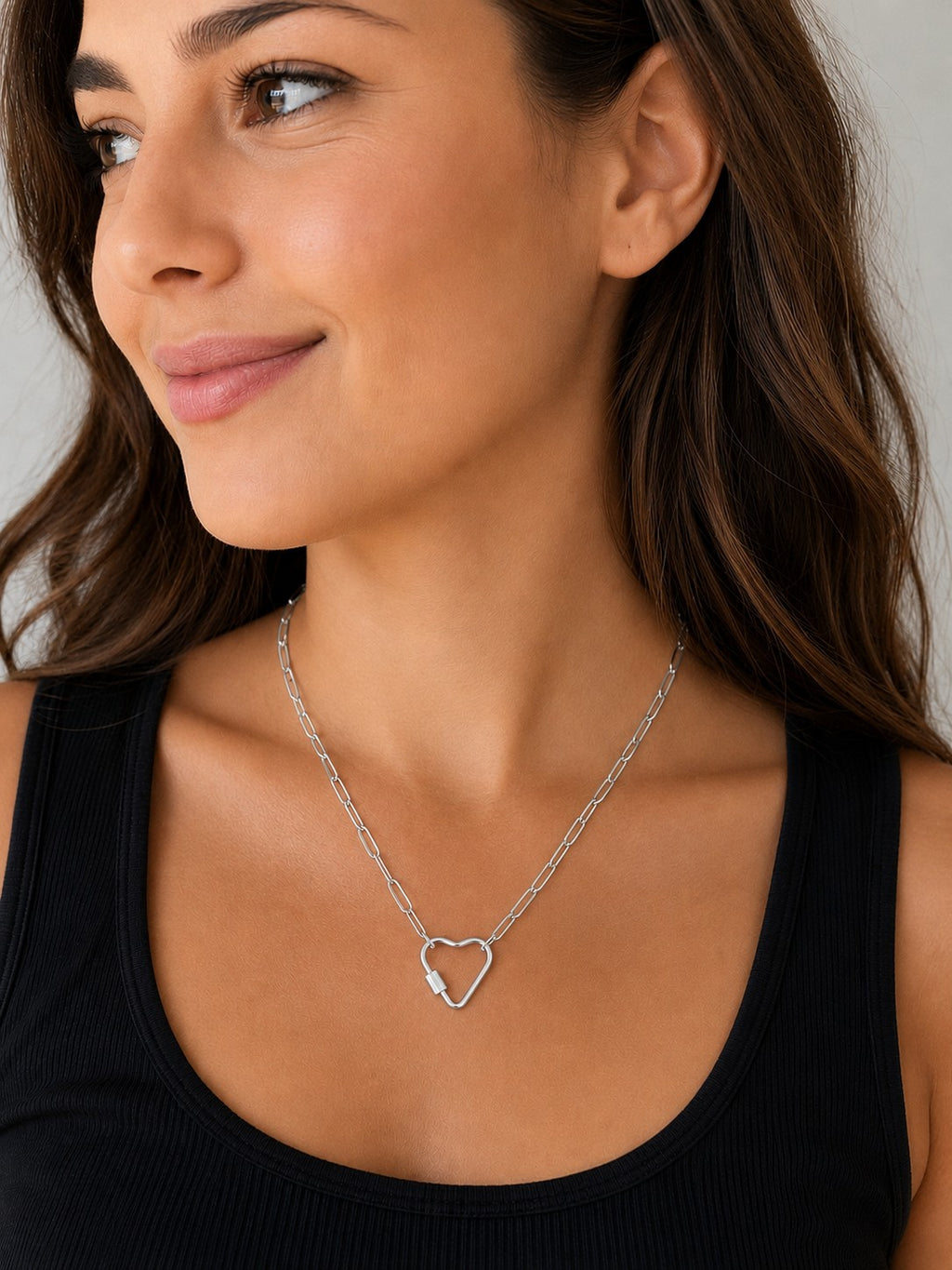Close-up of the DUGO silver Heart Carabiner Paperclip Chain Necklace worn on the neck