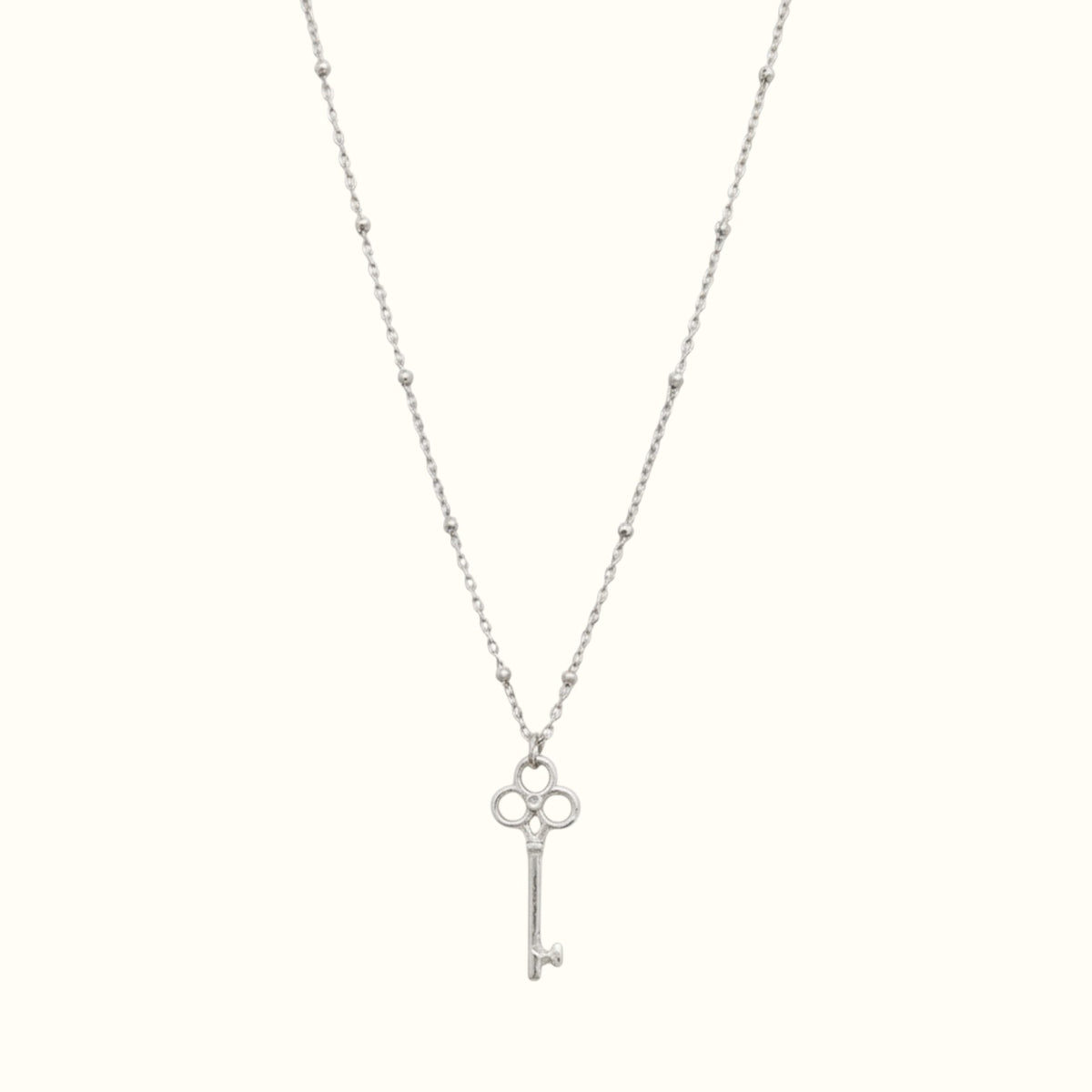 DUGO silver vintage-inspired key pendant necklace on a delicate beaded ball chain, waterproof and non-tarnish.