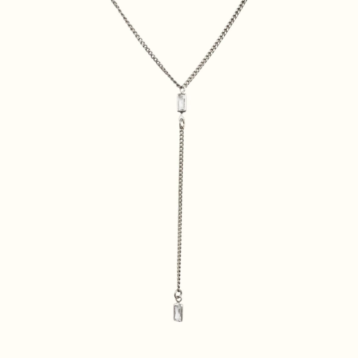 DUGO silver-tone lariat Y necklace featuring a thin Cuban chain and two clear baguette-cut cubic zirconia stones.