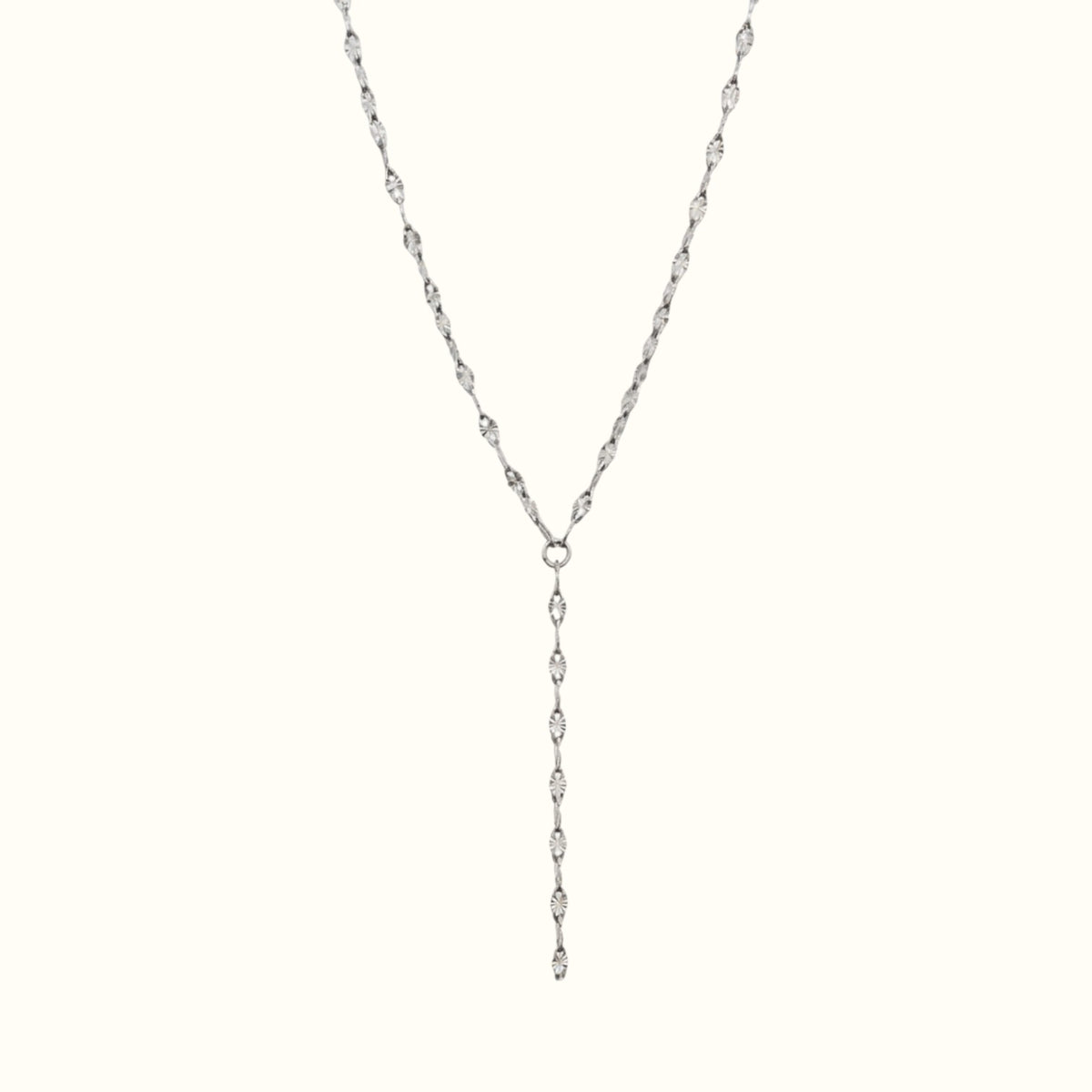 DUGO silver lariat necklace featuring a delicate chain with textured lip-shaped links in a Y-drop design.