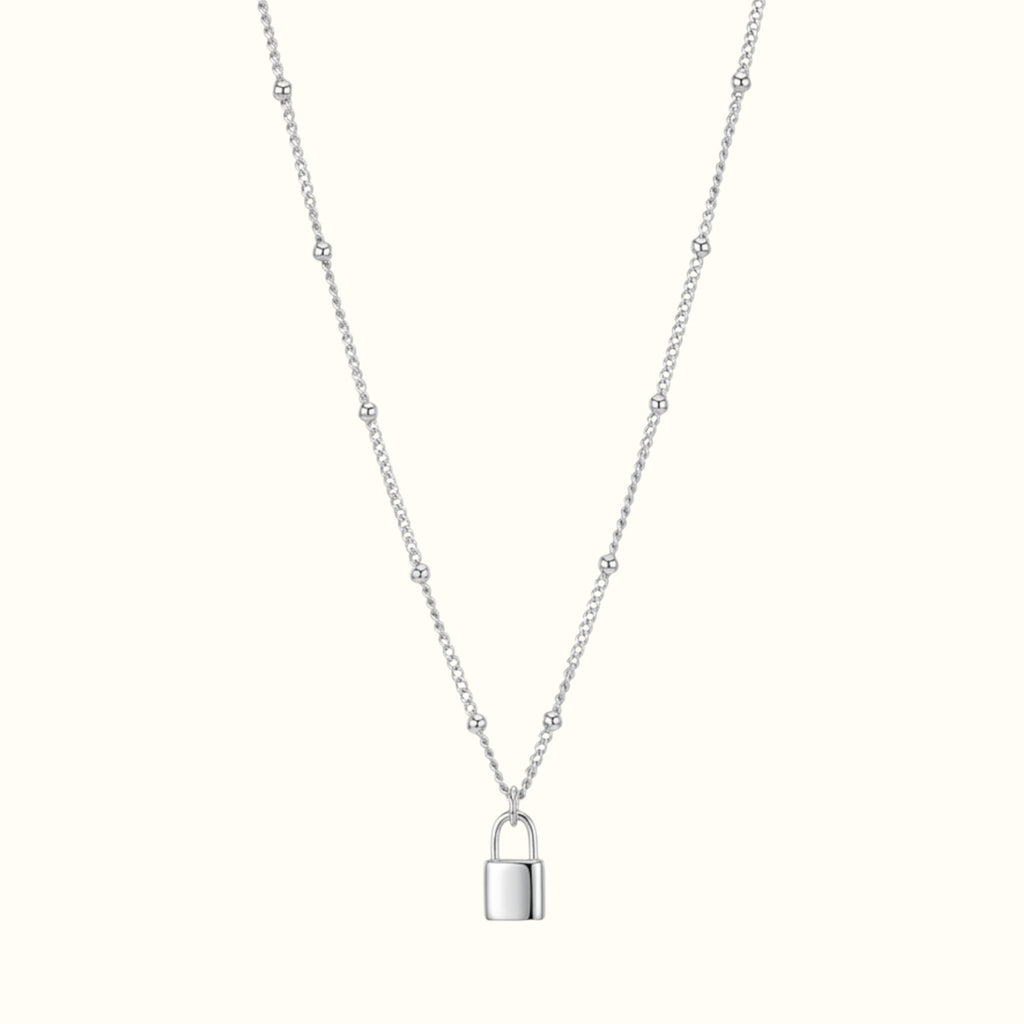 DUGO silver lock pendant necklace on a delicate ball chain, waterproof and tarnish-resistant minimalist jewelry.