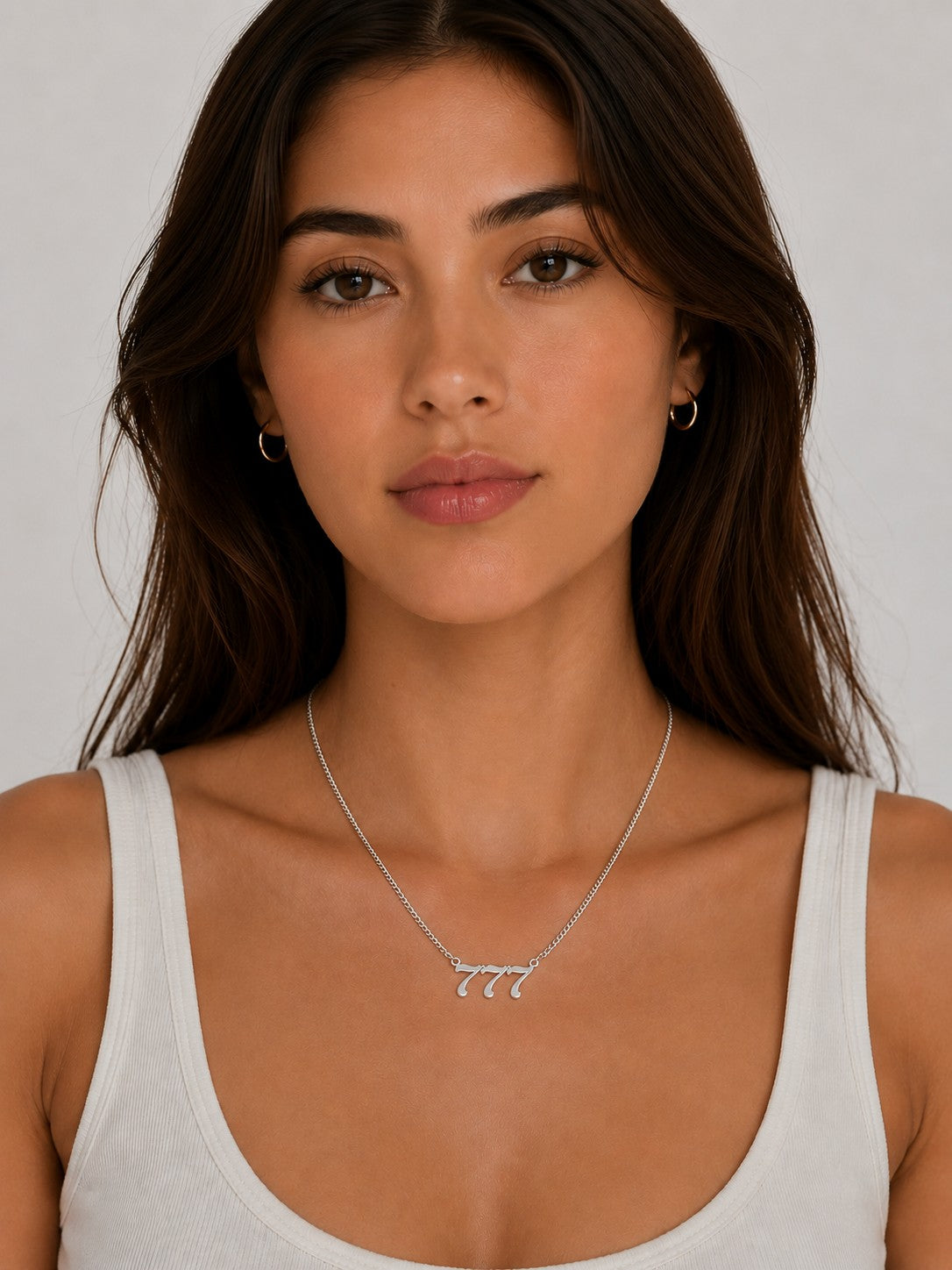 Close-up of the DUGO silver Lucky Number Necklace worn on the neck