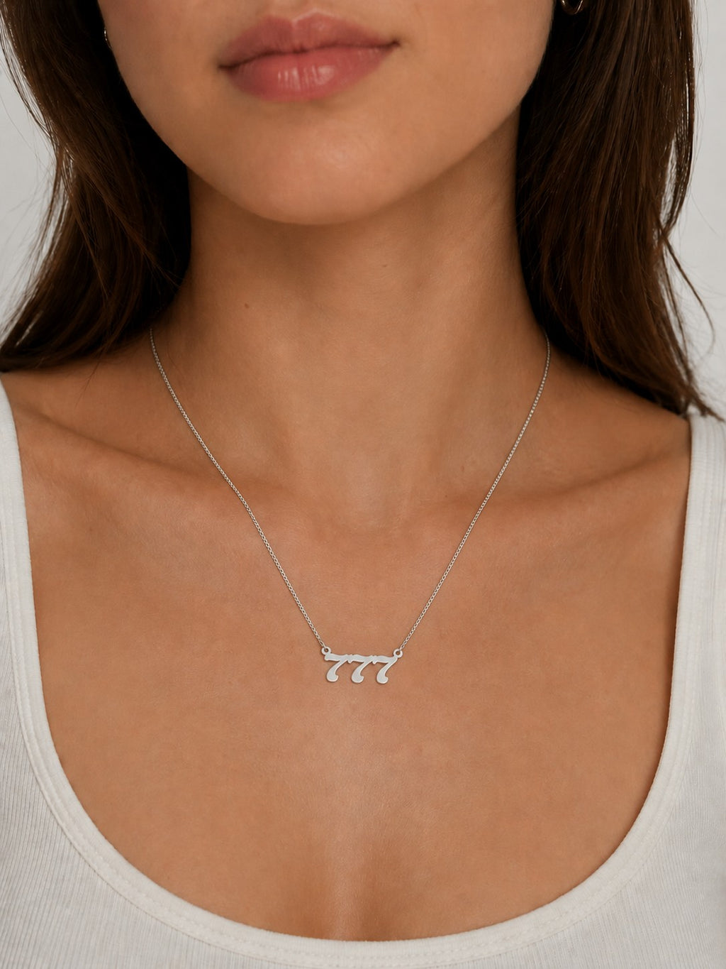 Woman wearing the DUGO silver Lucky Number Necklace