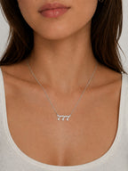 Woman wearing the DUGO silver Lucky Number Necklace