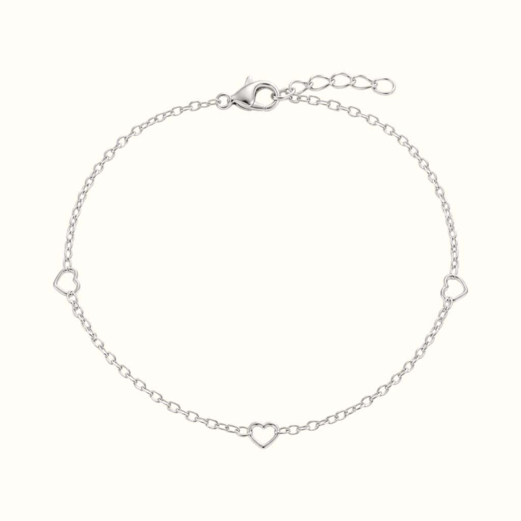 DUGO delicate silver chain bracelet with three minimalist open heart station links on a white background