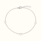 DUGO delicate silver chain bracelet with three minimalist open heart station links on a white background