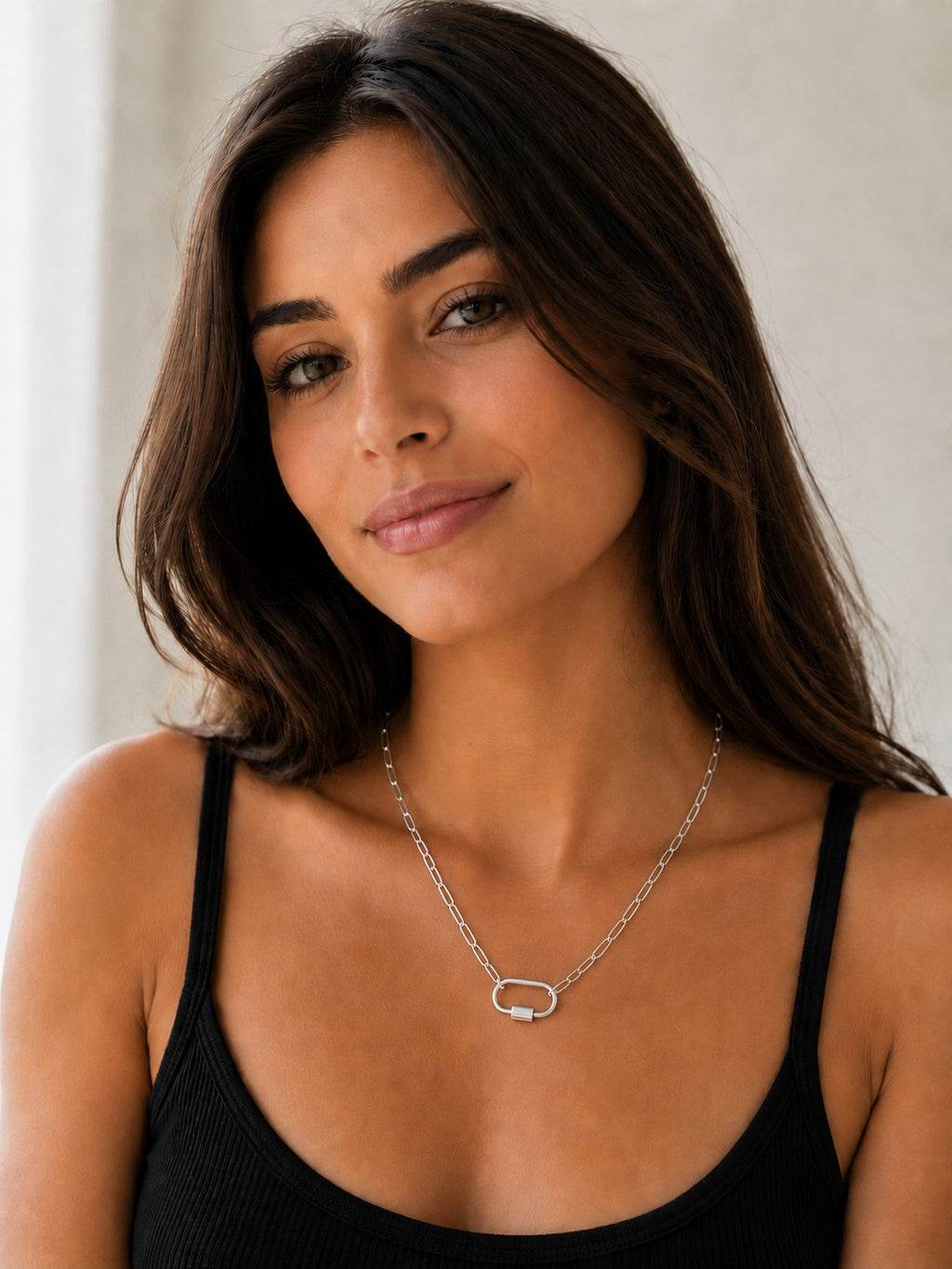 Close-up of the DUGO silver Oval Carabiner Thick Paperclip Chain Necklace worn on the neck