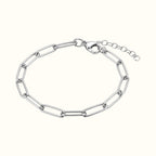DUGO silver paperclip chain bracelet with elongated links, lobster clasp, and adjustable extender chain.
