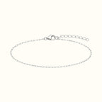 DUGO silver stainless steel dainty paperclip chain bracelet with an adjustable extender and secure lobster clasp.