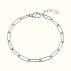 DUGO silver-tone paperclip chain bracelet with elongated links, lobster clasp, and adjustable extender chain.