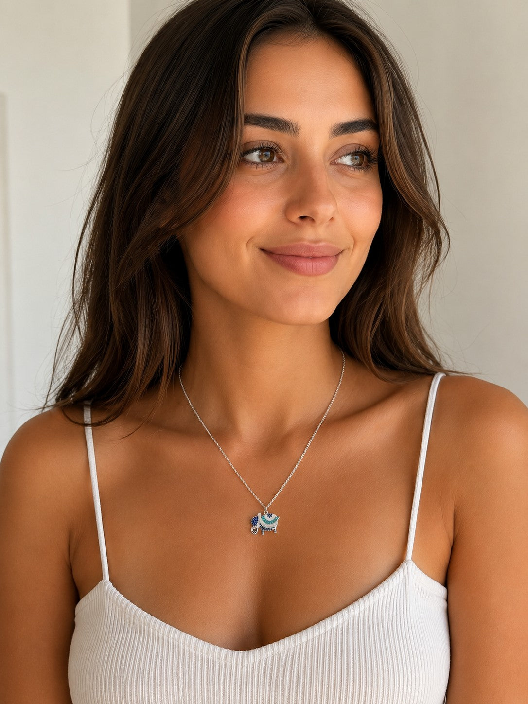 Close-up of the DUGO silver Pave Elephant Pendant Necklace worn on the neck