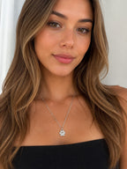 Close-up of the DUGO silver Paw Pendant Necklace worn on the neck