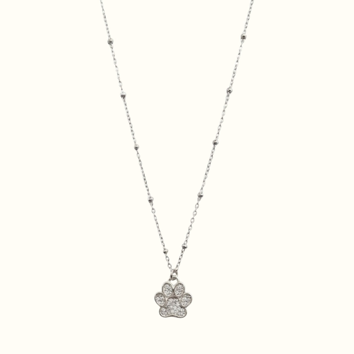 DUGO silver paw print pendant necklace with a delicate ball chain, perfect for pet lovers and everyday wear.