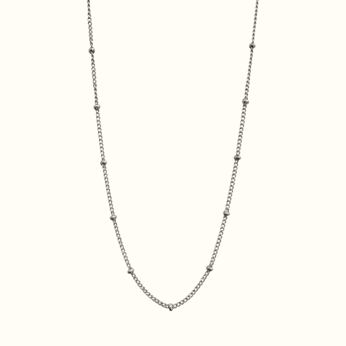DUGO silver-toned satellite bead chain necklace made of waterproof stainless steel for everyday layering.