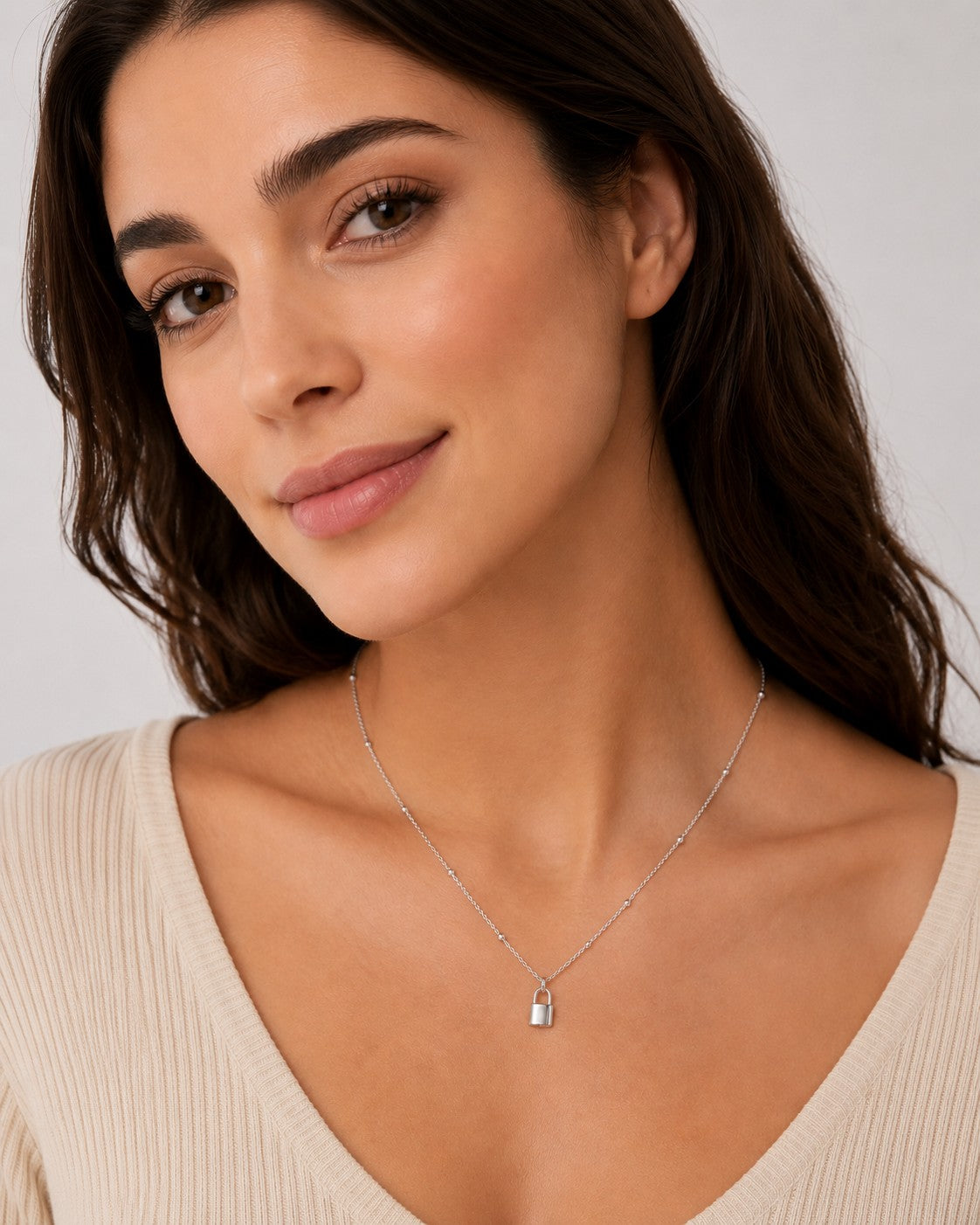 Close-up of the DUGO silver Satellite Chain Padlock Necklace worn on the neck