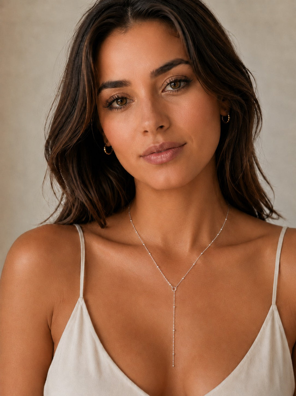 Close-up of the DUGO silver Satellite Chain Y Lariat Necklace worn on the neck