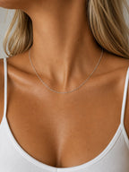 Close-up of the DUGO silver Singapore Chain Necklace worn on the neck