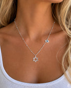 Woman wearing the DUGO silver Star David Classic with Evil Eye Charm Necklace
