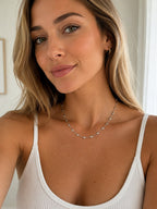 Woman wearing the DUGO silver Tiny Heart Chain Necklace