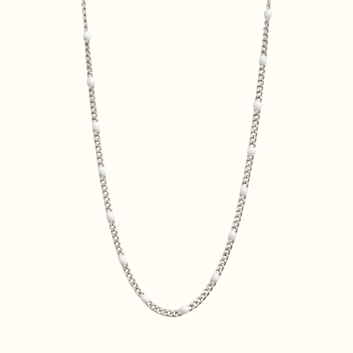 DUGO silver curb chain necklace featuring small white enamel beads, crafted from tarnish-resistant stainless steel.