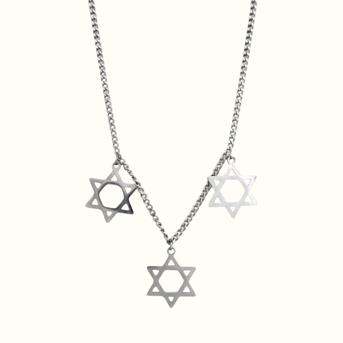 DUGO Star David Classic Trio Necklace featuring three silver-toned Star of David charms on a delicate metal chain.