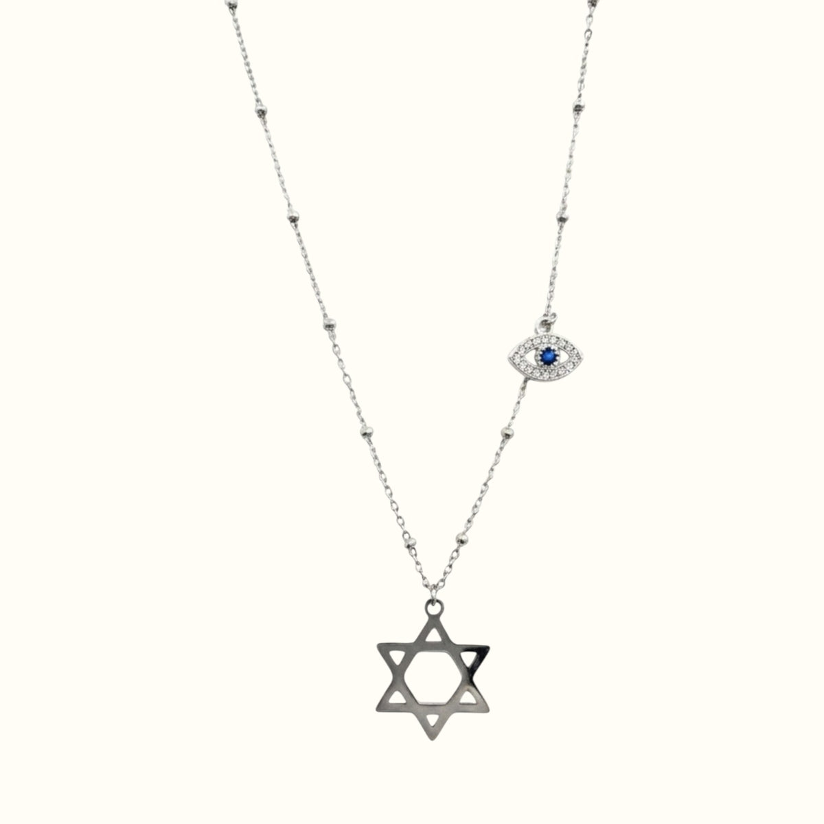 DUGO silver-tone Star of David necklace featuring a delicate chain with a blue evil eye charm and bead accents.