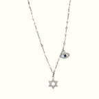 DUGO silver-tone necklace featuring a CZ-paved Star of David pendant and a blue evil eye charm on a delicate chain.