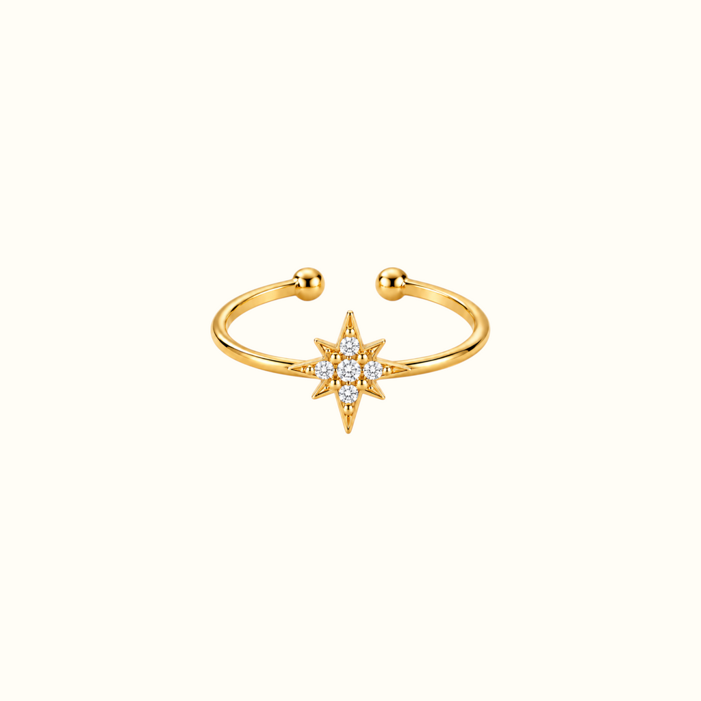 DUGO gold adjustable ring featuring a crystal-accented starburst design on an open band